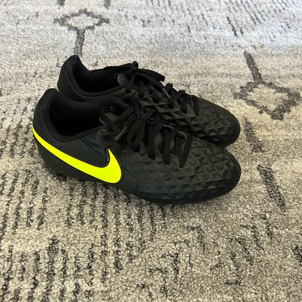 Nike size 3.5 soccer cleats black and neon green.